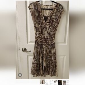 Love love this dress. Figure flattering zebra print .